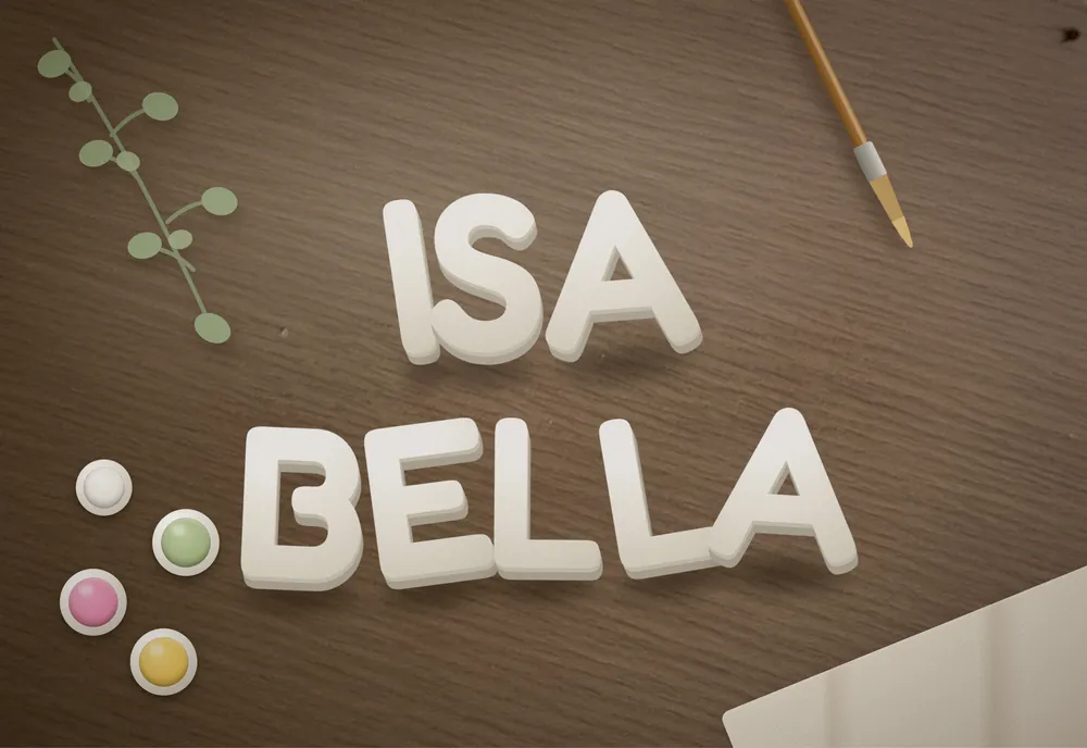 Isa Bella custom name sign in soft white plaster letters arranged on a walnut table with eucalyptus